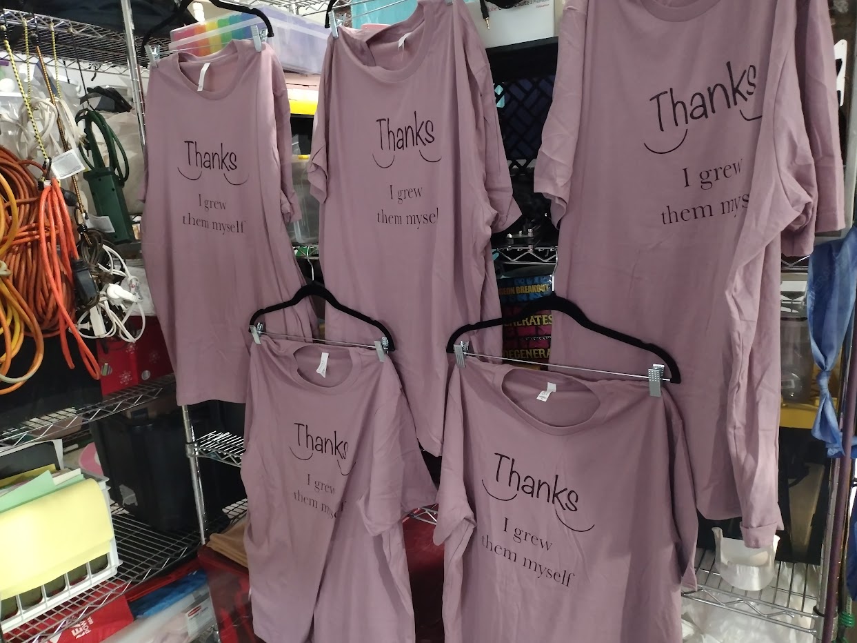 "Thanks, I grew them myself" t-shirts hanging in workshop