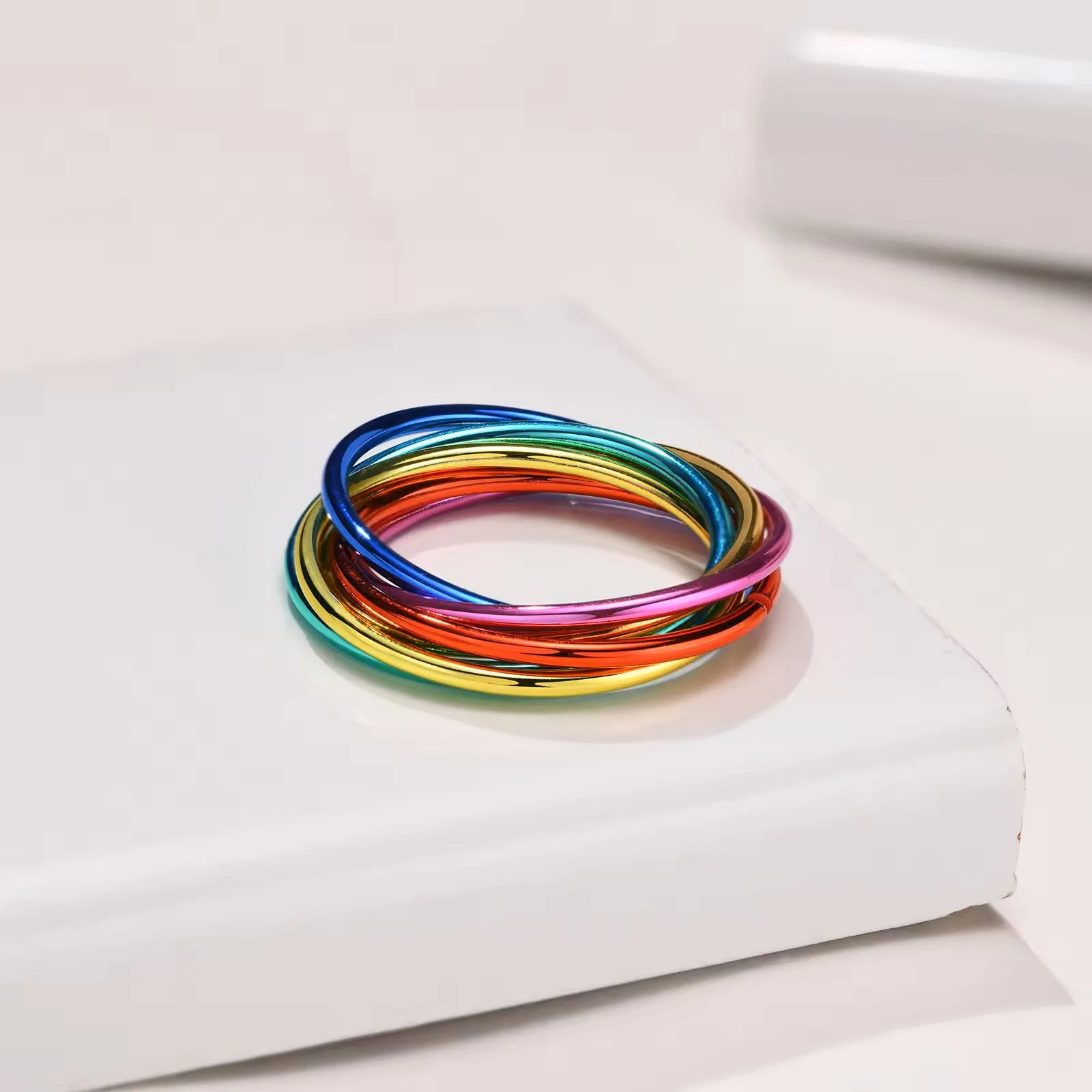 Rainbow Fidget Ring laying on a table