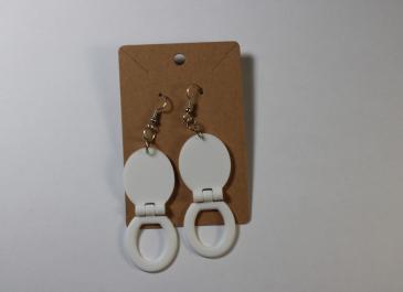 Two White Toilet Seat Earrings on display card