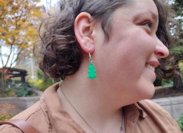 Woman wearing a blank tree earring