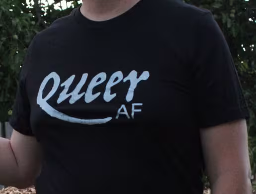 Close up of Jaelyn wearing Queer AF shirt